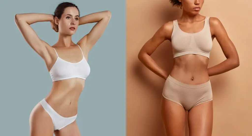 Two women displaying the results of their breast augmentation surgery.