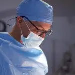 Dr. Capizzi in O.R. For Should I Get Cosmetic Surgery?